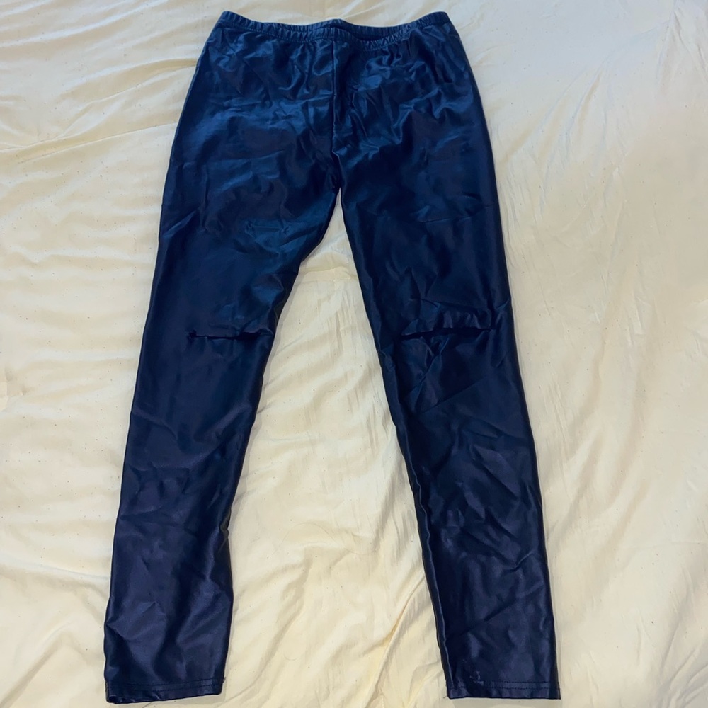 Black leather leggings with cut outs in knees.